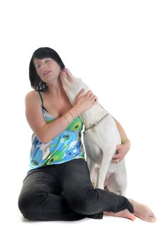 portrait of a purebred young argentinian dog and beautiful girl in front of white background