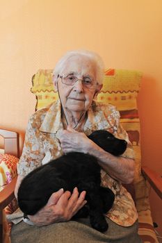 senior woman and her puppy purebred cocker spaniel