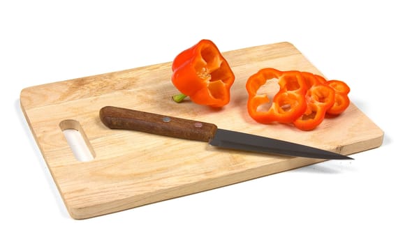 paprika with a knife on a cutting board isolated on a white background