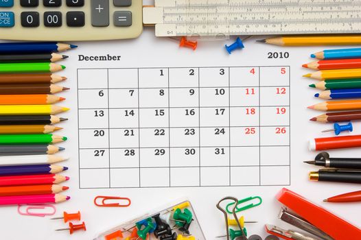 monthly calendar with the office, school and office supplies for December 2010