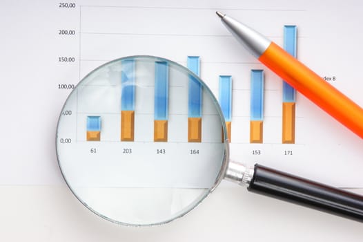 Graphs tables and documents laid on the table