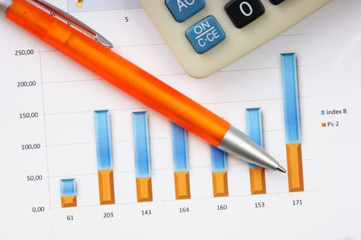 Graphs tables and documents laid on the table