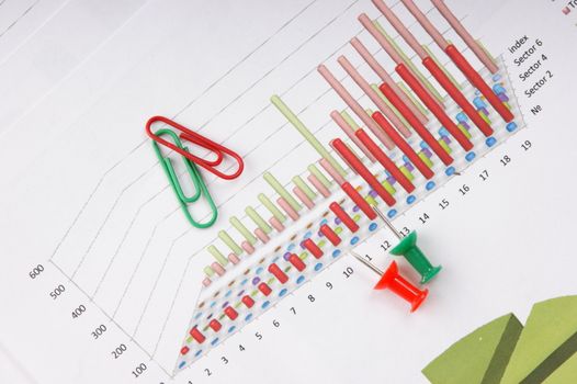 Graphs tables and documents laid on the table