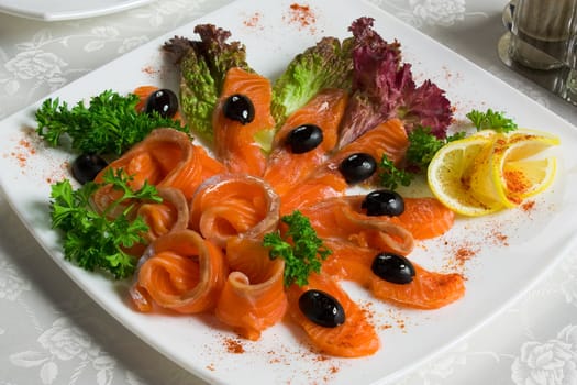 Fish, salted salmon sliced on a plate