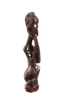 African statue of black wood isolated on white background