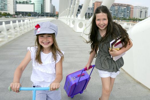 Little girls going to school with bags, books and student stuff