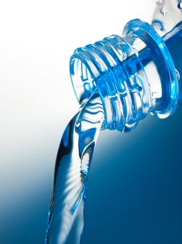 stream of water flows from the bottle