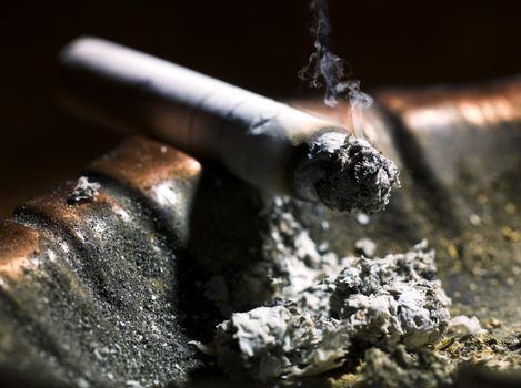 Cigarette butt in an ashtray