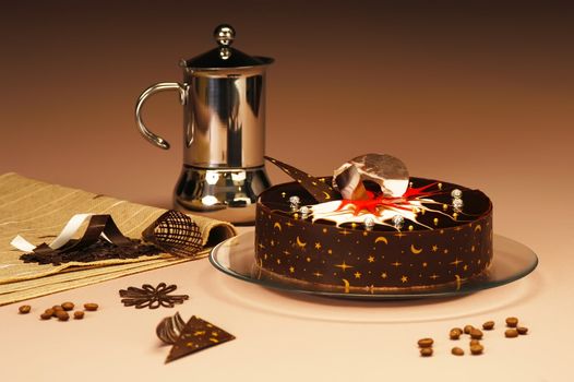 Chocolate cake on a platter with coffee