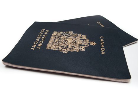 Two Canadian Passports, isolated on white.