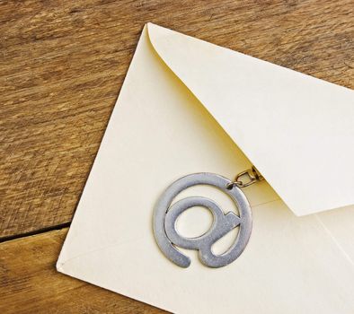 letter on the background of old wooden planks