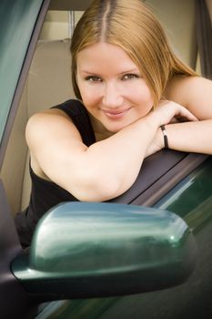 pretty woman looking in the car window