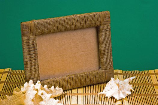 Frame of seashells on a background mat