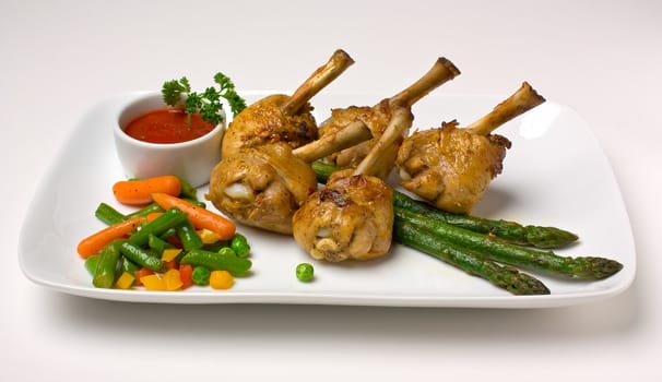 chicken legs with asparagus, lettuce and ketchup
