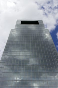 A modern medical skyscraper reaching into the blue sky