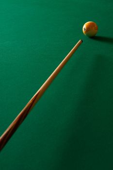 The game of billiards on a table with green cloth