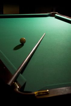 The game of billiards on a table with green cloth