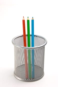 Pencils in basket isolated on a white background