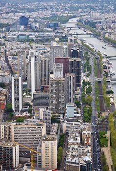 Center of Paris from the heights. View from the Eiffel Tower on the river Seine. Modern architecture.