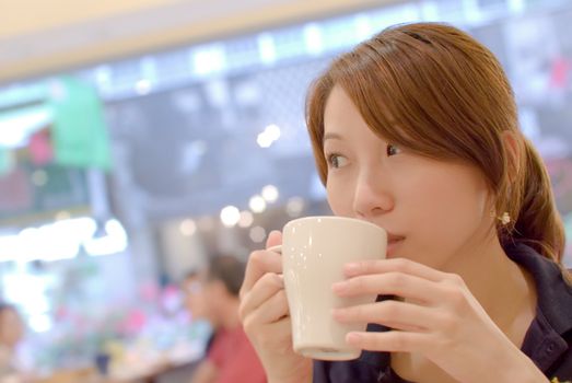 Here is an asia beautiful girl with coffee.