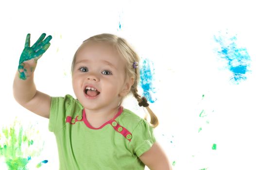 A little girl standing in studio