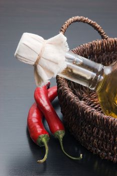 bottle of sunflower oil and vegetables in a country style