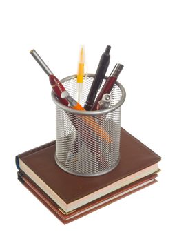 basket with pens and pencils isolated on a white background