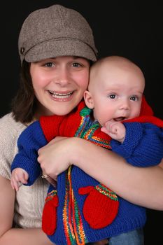 Beautiful mother and baby on a black background