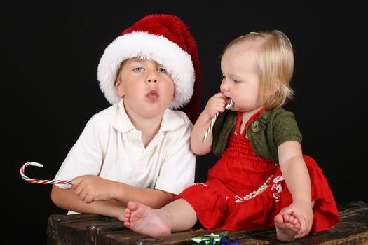 Christmas brother and sister eating Candy Canesadorable