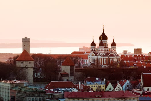 Capital of Estonia, Tallinn is famous for its World Heritage old town walls and cobbled streets. Sunset illuminates the Alexander Nevsky Cathedral and castle walls