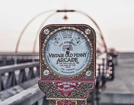 Antique scales on entrance to Southport Pier in Lancashire, England