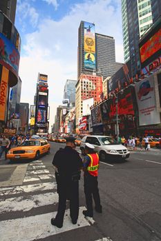 The famous Times Square at Mid-town Manhattan - a wide angle view