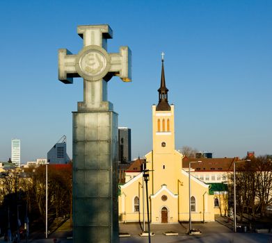 Capital of Estonia, Tallinn is famous for its World Heritage old town walls and cobbled streets. St. John's Church is in Freedom Square with the Glass Cross commemorating freedom from the Soviets