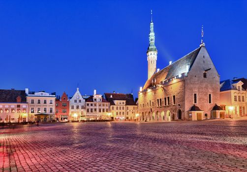 Town hall in Raekoja square in Tallinn in Estonia at dusk as the buildings are illuminated