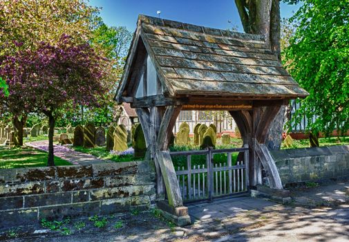 Half timbered church of Great Altcar near Formby in Lancashire, England seen through lych gate