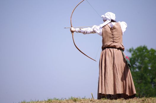 an archer is launching the arrow