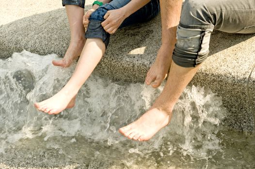 Choldren washing of feet in a fountain 