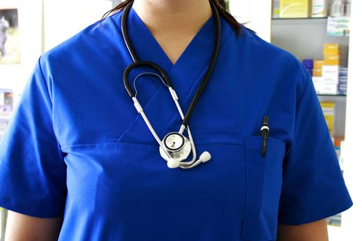 Closeup of blue nurse uniform and stethoscope