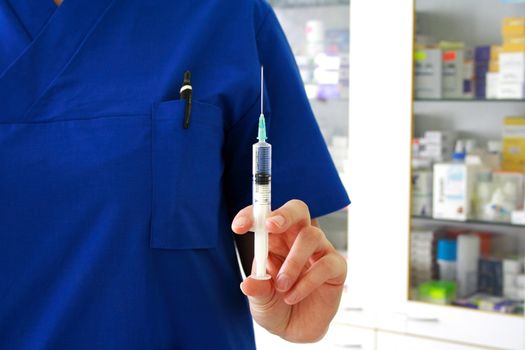 Vaccination concept. Nurse is holding syringe in hand