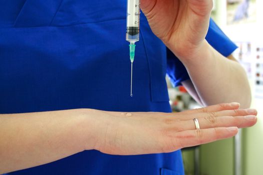 Vaccination concept. Nurse is holding syringe in hand