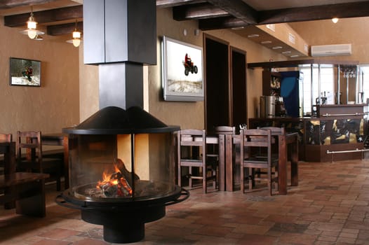 Interior of modern cafe with a fireplace