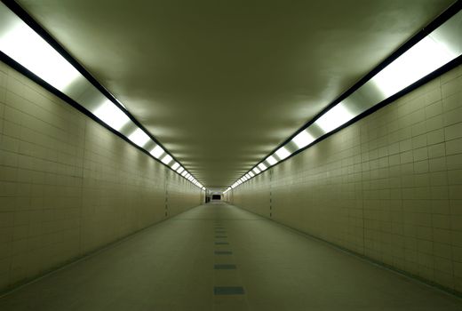 Evening empty subway below train station leading to the platforms