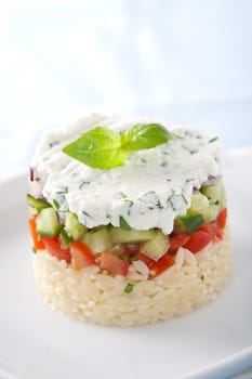 Small tower of risoni, tomatoes, cucumber and ricotta with herbs