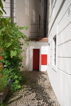 little red door in the wall in the center of Prague
