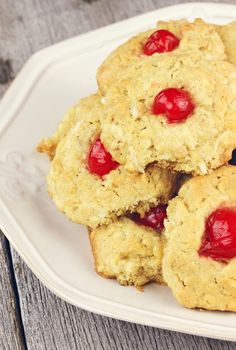 Bachelor Buttons cookies. Delicious cookies with a cherry center on a rustic background. Shallow DOF.
