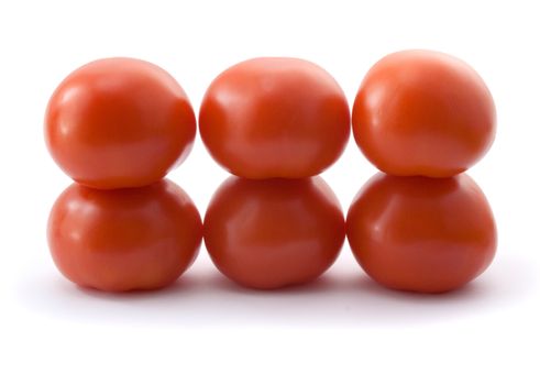 six fresh red tomatoes on white background