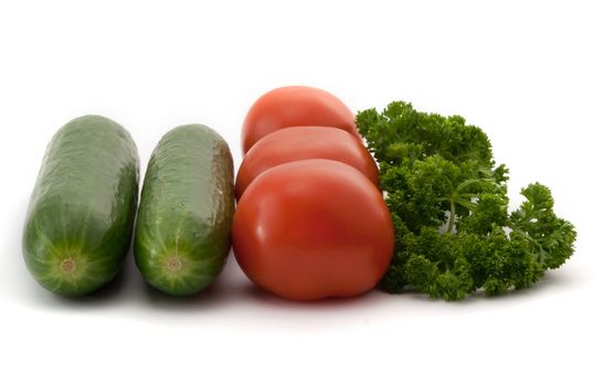 several different fresh vegetables on white background