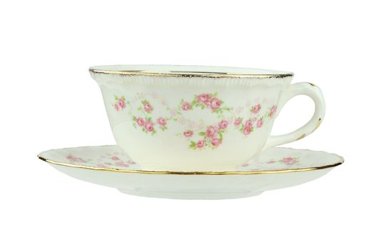 Flowered antique tea cup and saucer isolated on a white background with clipping path.
