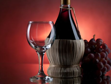 Red wine, glass and bottle