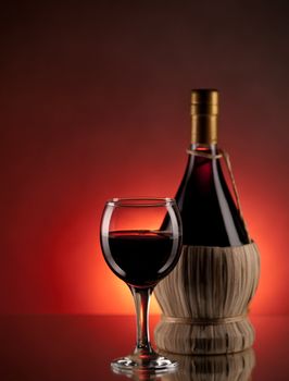 Red wine, glass and bottle